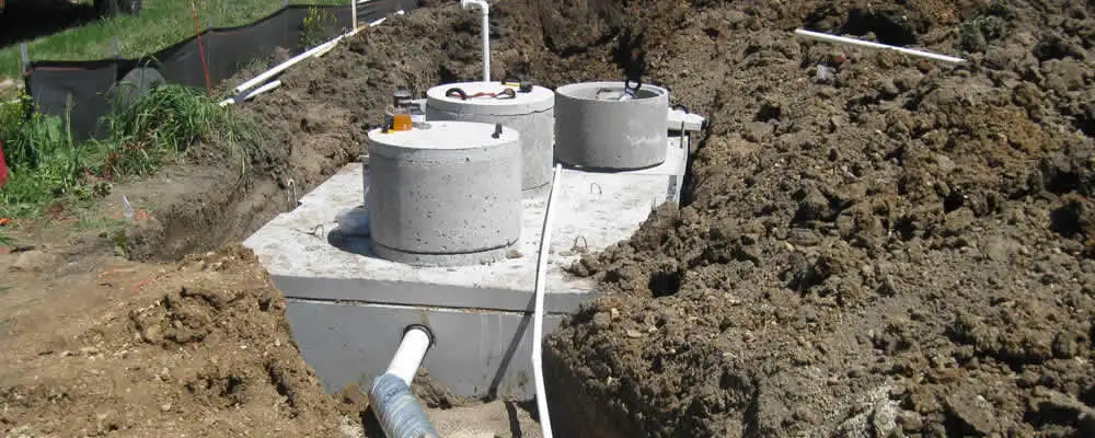 Septic system repair and installation site with tank access ports in Aurora, CO